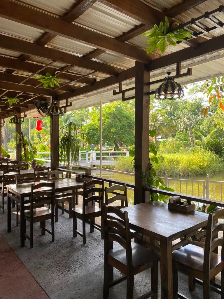 Covered dining deck beside the garden pond